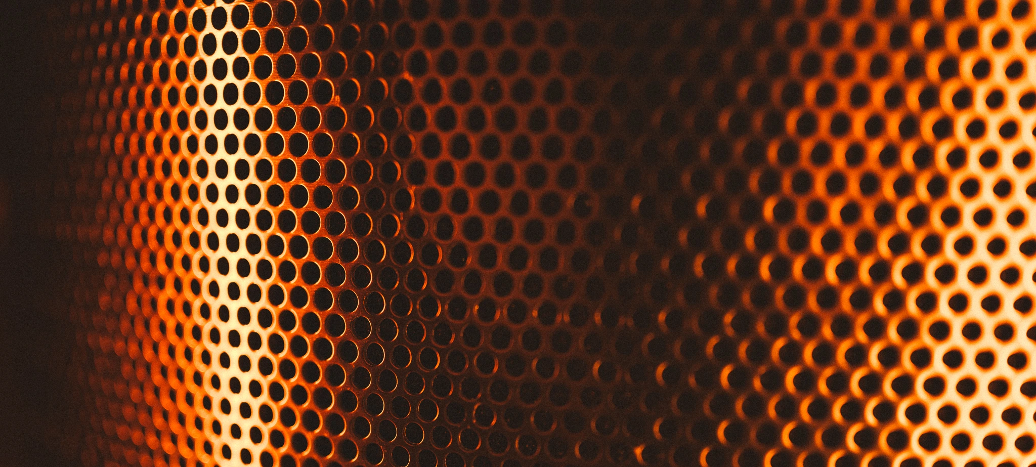 Warm light through a microphone grille
