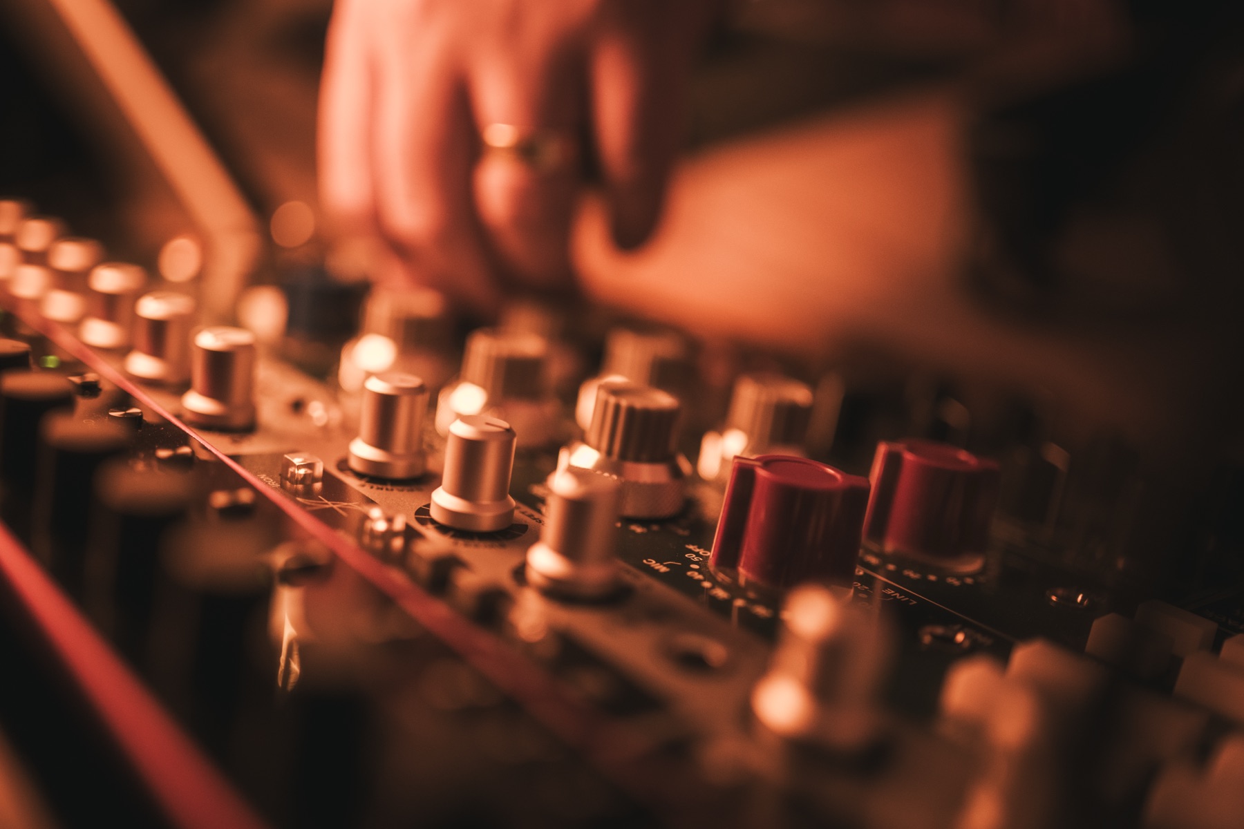 Hands on a mixing console