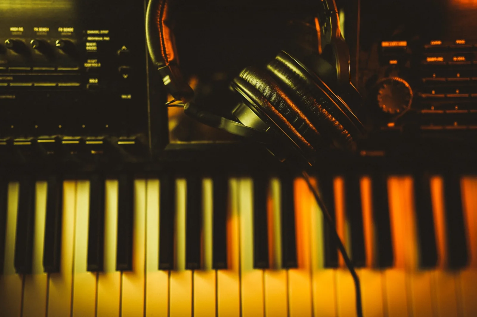 Headphones resting on studio keys